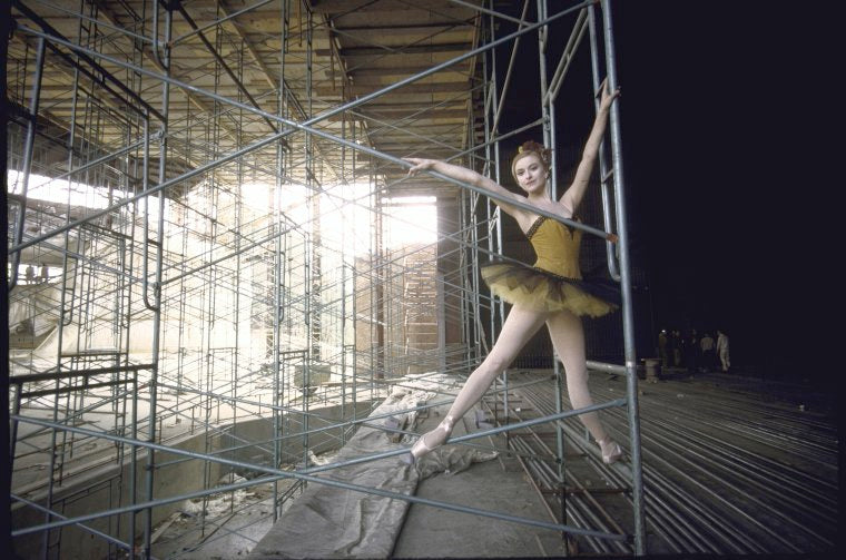 New York City Ballet dancer Violette Verdy poses in front of the construction of the new Saratoga Performing Arts Center (Saratoga)