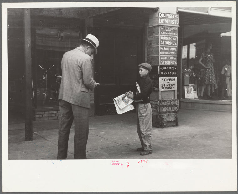 Newsboy on main street, Montrose, Colorado