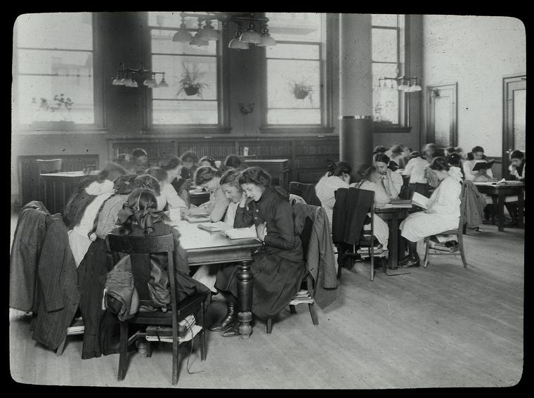 Work with schools, Tompkins Square : girls fill reading tables, school visit, April 13, 1910