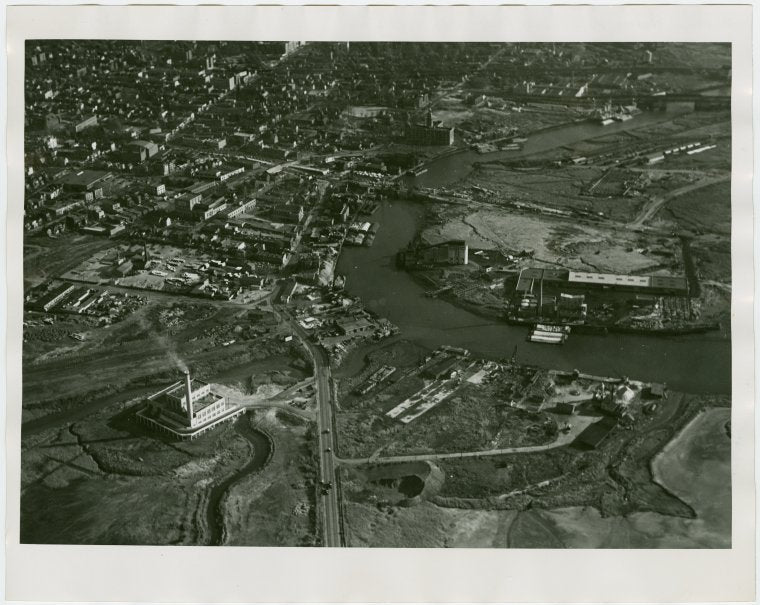 Fairgrounds - Pre-Construction - Flushing River with bridge under construction, aerial view