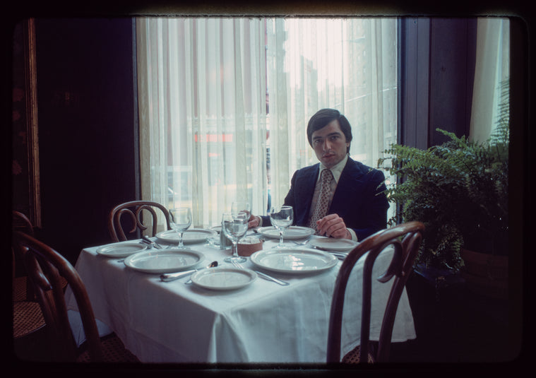 Man seated at dining table, 1057 Restaurant