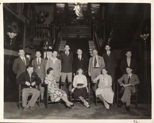 1932. Back row: Ernst Paul Fiene, Joshua Kunitz, Leonard Ehrlich, Aaron Copland, George Milburn, Waldo Frank, Morris L. Ernst, Joseph Vogel. Front row: Malcolm Cowley, unidentified woman, Marion Greenwood, unidentified woman and man