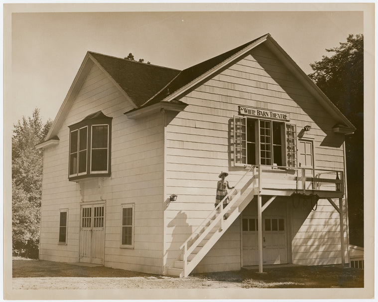 Exterior of the White Barn Theatre with Lucille Lortel on steps, ca. 1940s