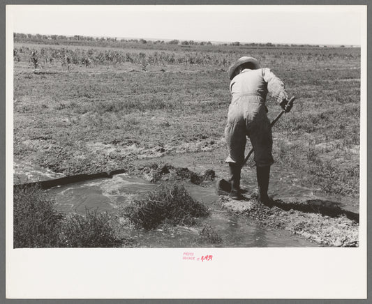 Mr. Johnson, F.S.A. client with part interest in cooperative well irrigating his fields near Syracuse, Kansas