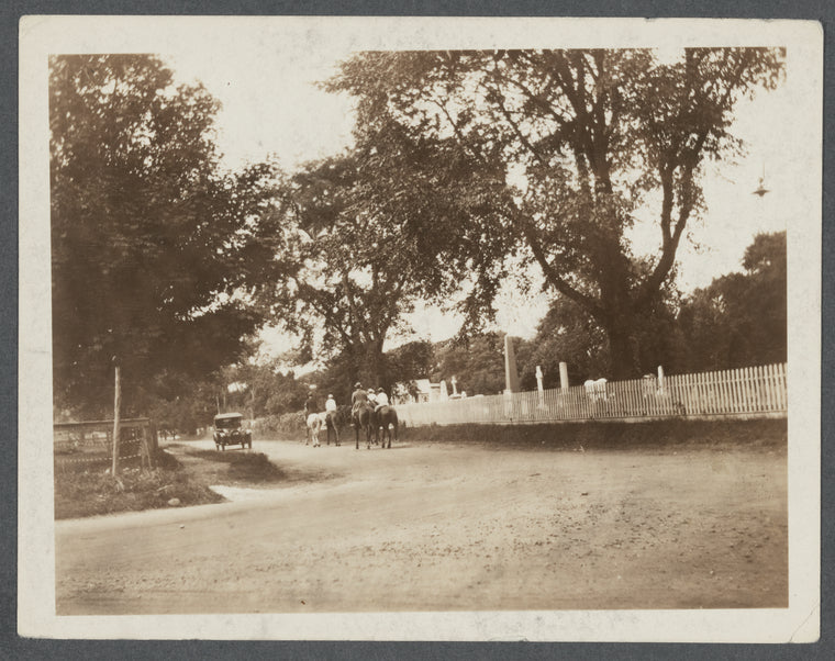 Photo of people and horses between the Gardiner's house and the Cemetery. East side of Main Street. East Hampton, East Hampton