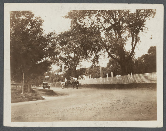 Photo of people and horses between the Gardiner's house and the Cemetery. East side of Main Street. East Hampton, East Hampton