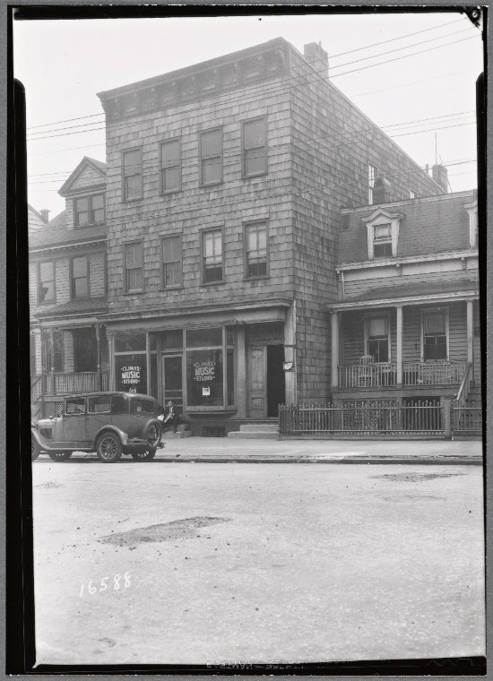 Wood frame building & Victorian houses; Climax Music Studio