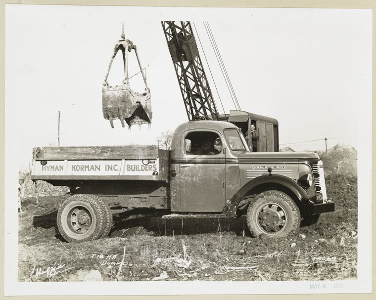 Model  T 18 HA loading onto Hyman Korman Inc. Builders truck