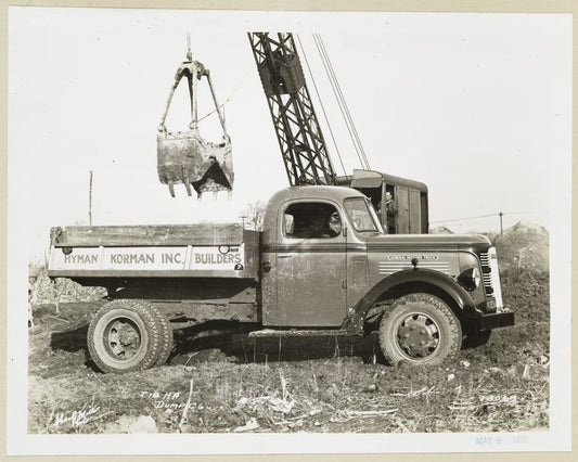 Model  T 18 HA loading onto Hyman Korman Inc. Builders truck