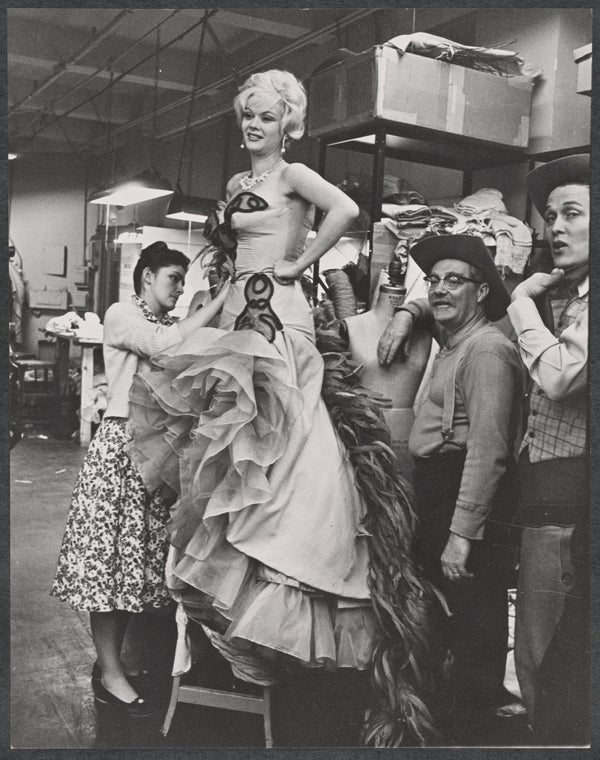 Monique Van Vooren, William Griffis, Jimmy Dean and unidentified in costume fitting for the stage production Destry Rides Again