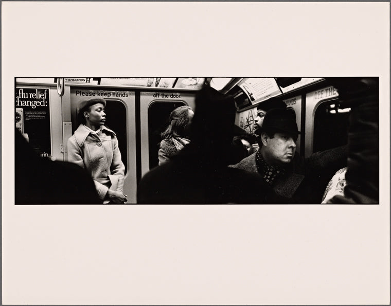 Young Black Woman in New Coat: Tough Looking Man in Small Hat