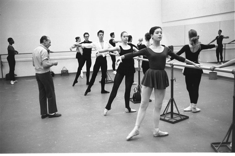 New York City Ballet Company Class with George Balanchine and front at the barre are Suzanne Farrell (2nd) and Teena McConnell (New York)