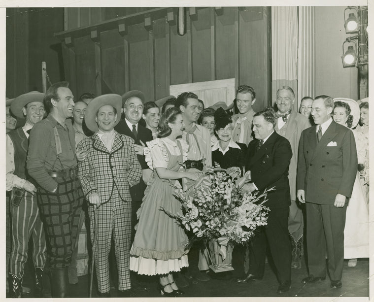 Howard Da Silva (Jud Fry), Joseph Buloff (Ali Hakim), Joan Roberts (Laurey), Alfred Drake (Curly), Theresa Helburn (Theatre Guild), Mayor La Guardia, Richard Rodgers (music), and various cast and crew at the 1st anniversary of Oklahoma!