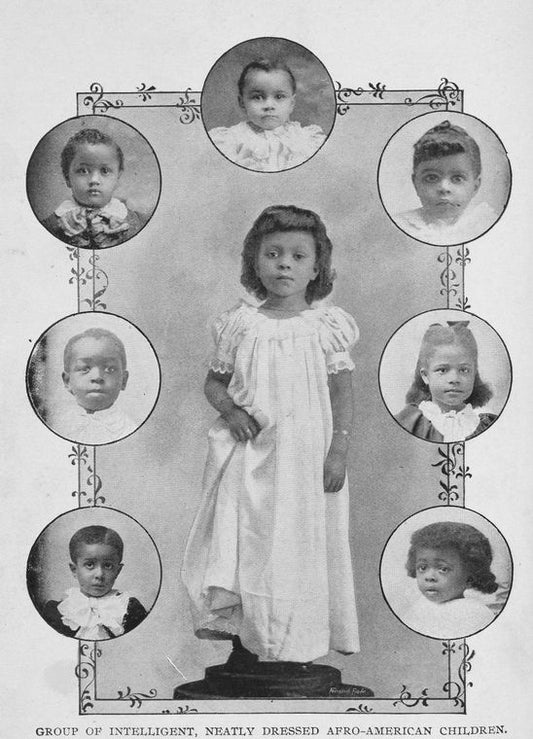 Group of intelligent, neatly dressed Afro-American children.