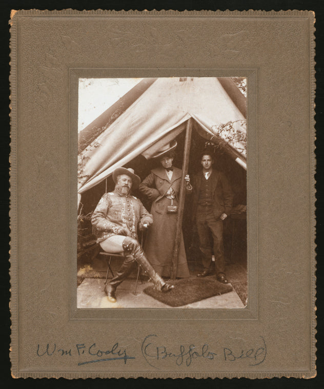 William F. Cody, seated left, with unidentified others
