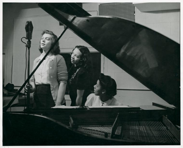 Woman at microphone, radio workshop