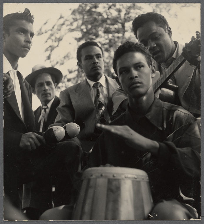 Photograph of five men, some holding various instruments