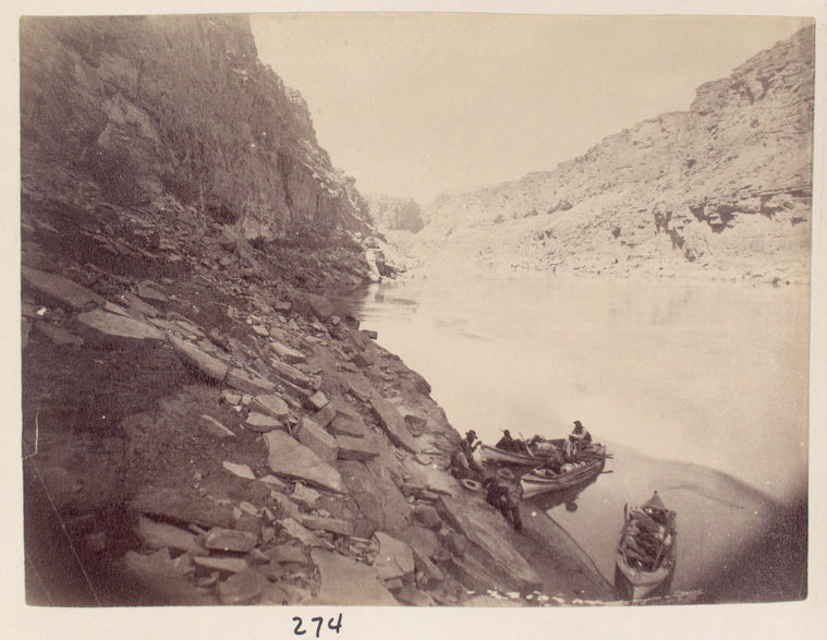 Canyon with three boats on the riverbank