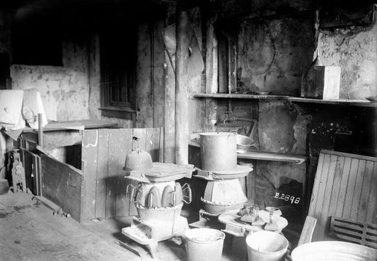Approximately 10 irons on stove