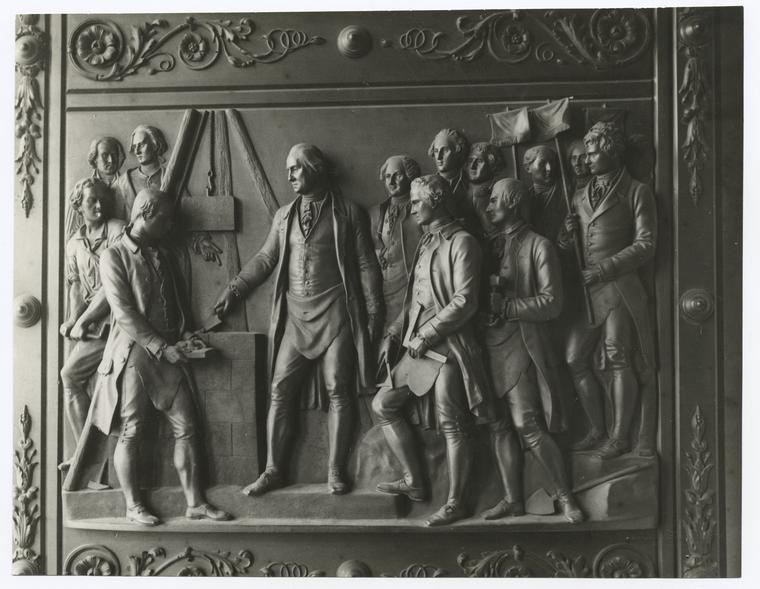 Laying the corner stone of the Capitol, Sept. 3, 1793 - after a panel on one of the bronze doors. Capitol building, Washington, sculptured by Randolph Rogers.