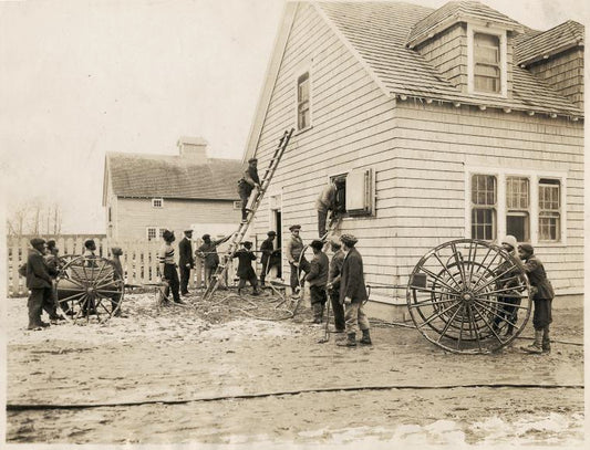 Howard Orphanage and Industrial School children learning how to use fire fighting equipment