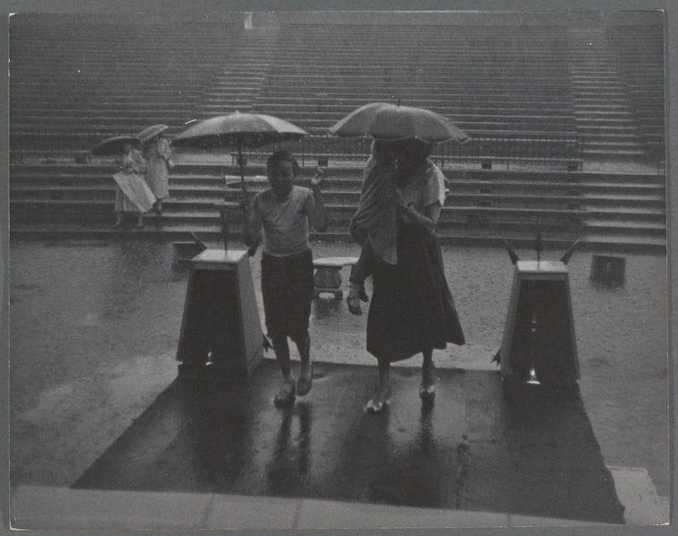 People in the rain at the East River Park Amphitheatre