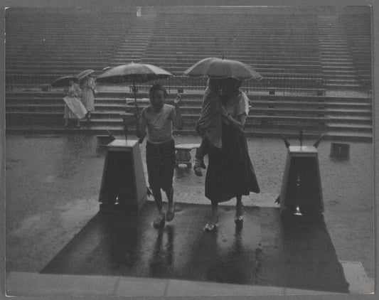 People in the rain at the East River Park Amphitheatre