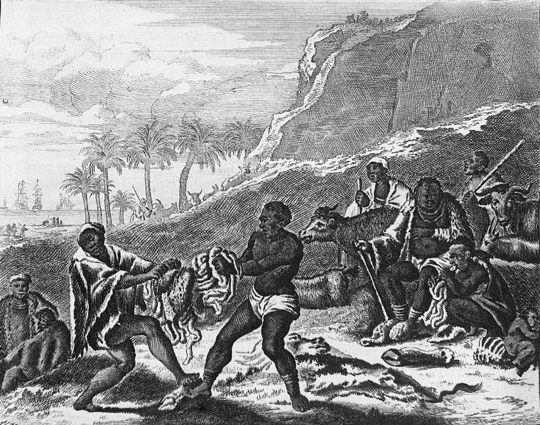 Men pulling an animals loins apart.