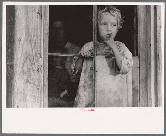 Daughter of sharecropper, Wilmington, North Carolina. Mother and another child in background