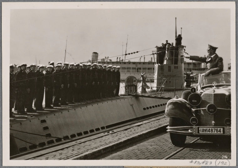 The Fuhrer visited Wilhelmshaven to meet the crews of successful U-boats, among them the men of the submarine which sank the English aircraft carrier "Courageous".  The Führer greets the assembled crew