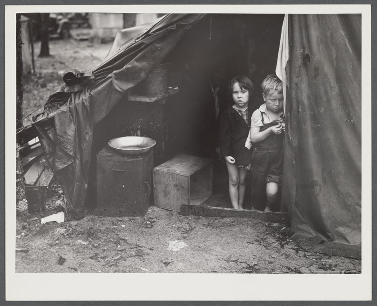 Children in tent home of construction workers. Ten men, two women and two children live here. Near Alexandria, Louisiana.