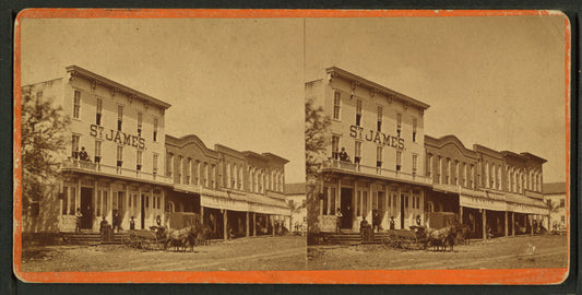 Commercial street with view of St. James hotel(?).