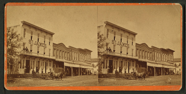 Commercial street with view of St. James hotel(?).