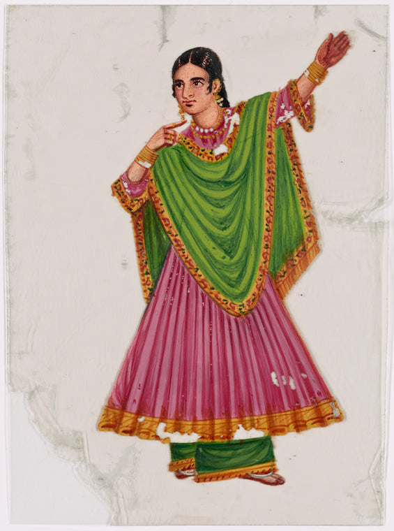 Dancing girl in green skirt and pink scarf, left arm raised