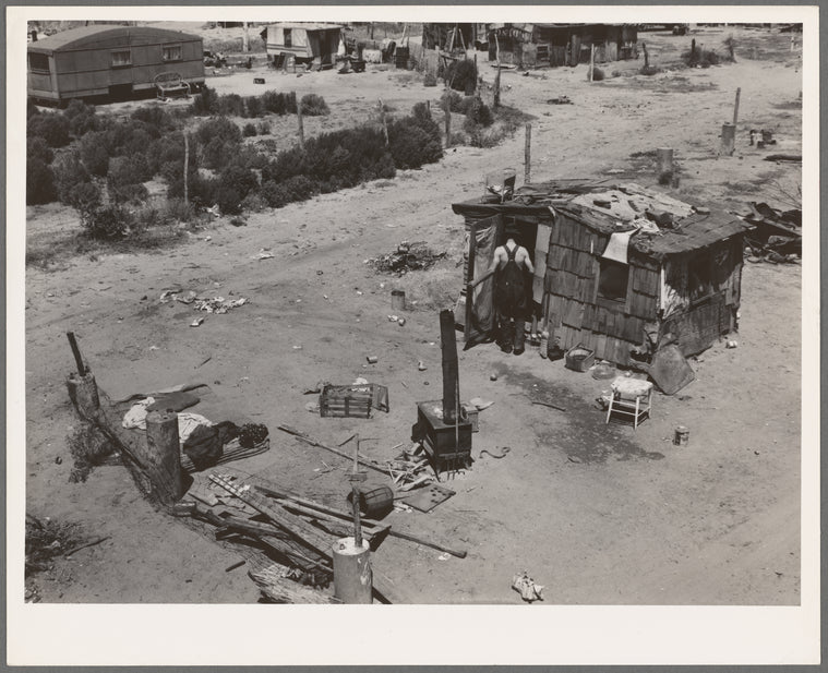 Shack home and yard. Mays Avenue camp, Oklahoma City, Oklahoma. Notice crude fence made of old water boilers and discarded fencing
