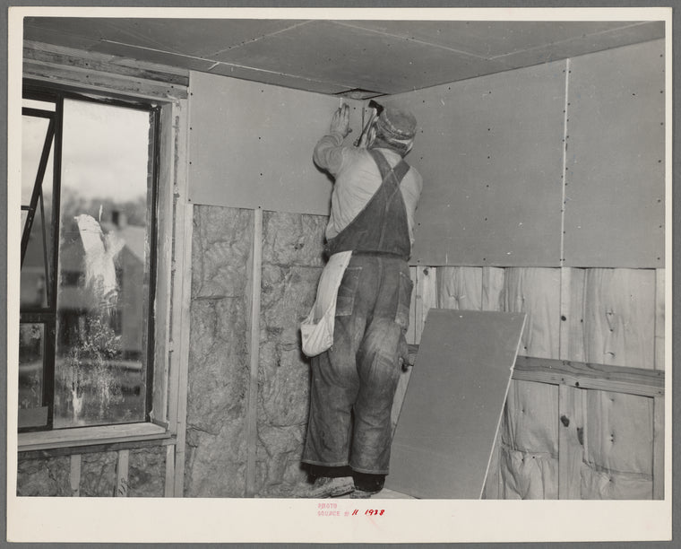 Installing wallboard in a house. Greenhills project, Ohio