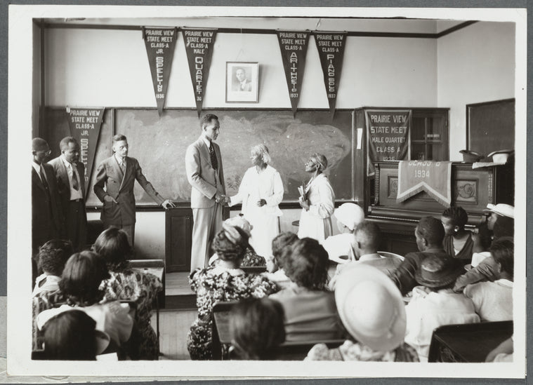 O.J. Thomas congratulates the oldest students in the district
