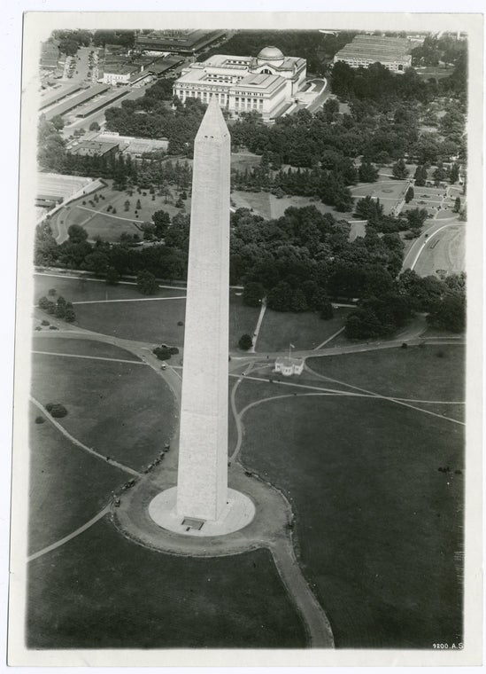 Washington D.C., the Washington Monument in foreground, National Museum at apex; upper left center market; upper right temporary War Department buildings, Dept. of Agriculture grounds in center.