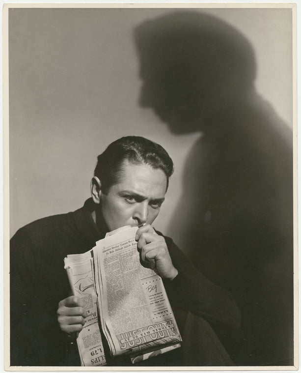 Alexander Kirkland (with newspaper) in the stage production Case of Clyde Griffiths