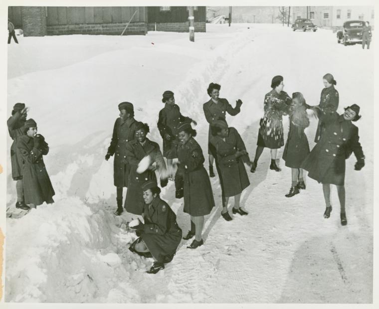African American members of the Women's Army Corps standing in the snow and throwing snowballs at each other, Camp Shanks, New York