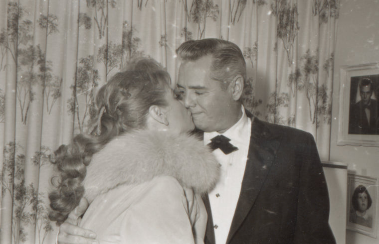 Lucille Ball kisses Desi Arnaz on opening night of Wildcat