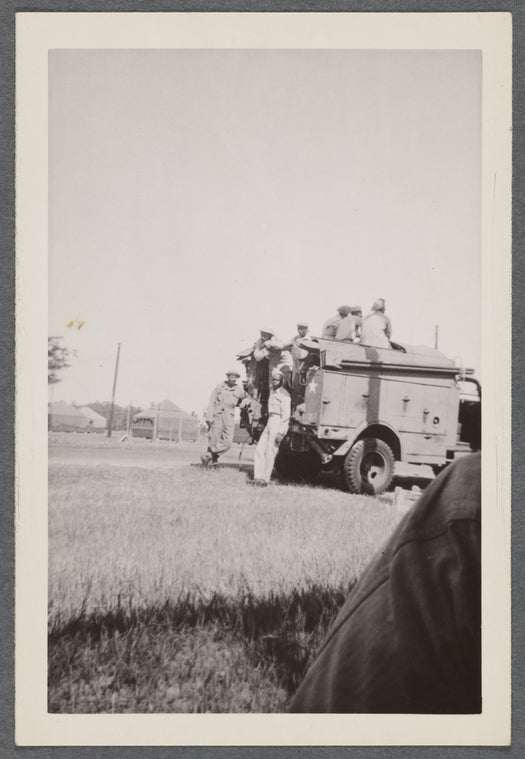 Men in uniform at military truck