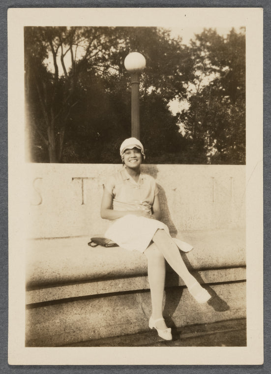Jean Blackwell Hutson sitting by lamppost