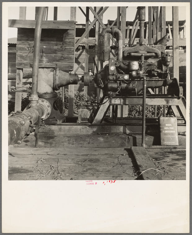 This pumping plant for irrigation is powered by a natural gas engine which operates on cost of about 1/2 the cost of electricity, Tulare County, California