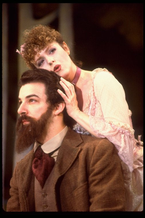 Actors Bernadette Peters and  Mandy Patinkin (as painter Georges Seurat) in a scene from the Broadway production of the musical "Sunday In The Park With George." (New York)
