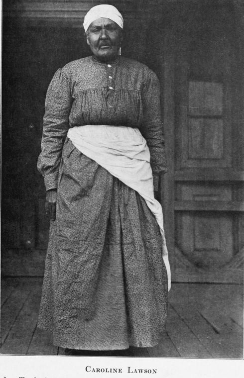 Caroline Lawson.  Judge Tayloe's "Black Mammy," standing on the "gallery" of the plantation house.