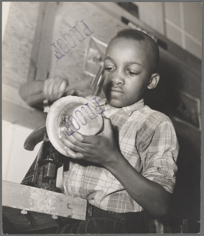 Harlem Community Art Center: student in metal craft class, 290 Lenox Avenue