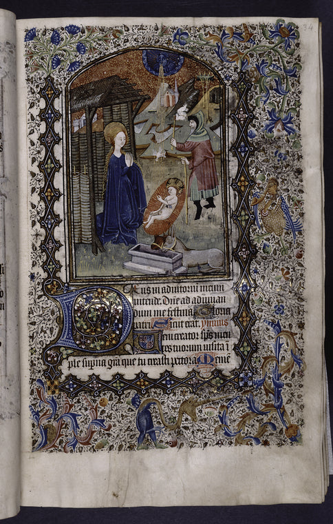Miniature of the Nativity, with border design, initials, placemarkers, rubrics.