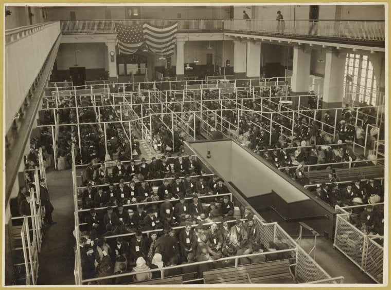 The pens at Ellis Island, Registry Room (or Great Hall). These people have passed the first mental inspection.