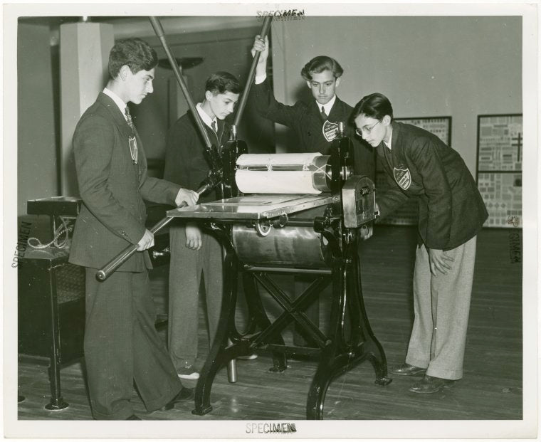 Great Britain Participation - Stamp Exhibit - Students from New York School of Printing examine press